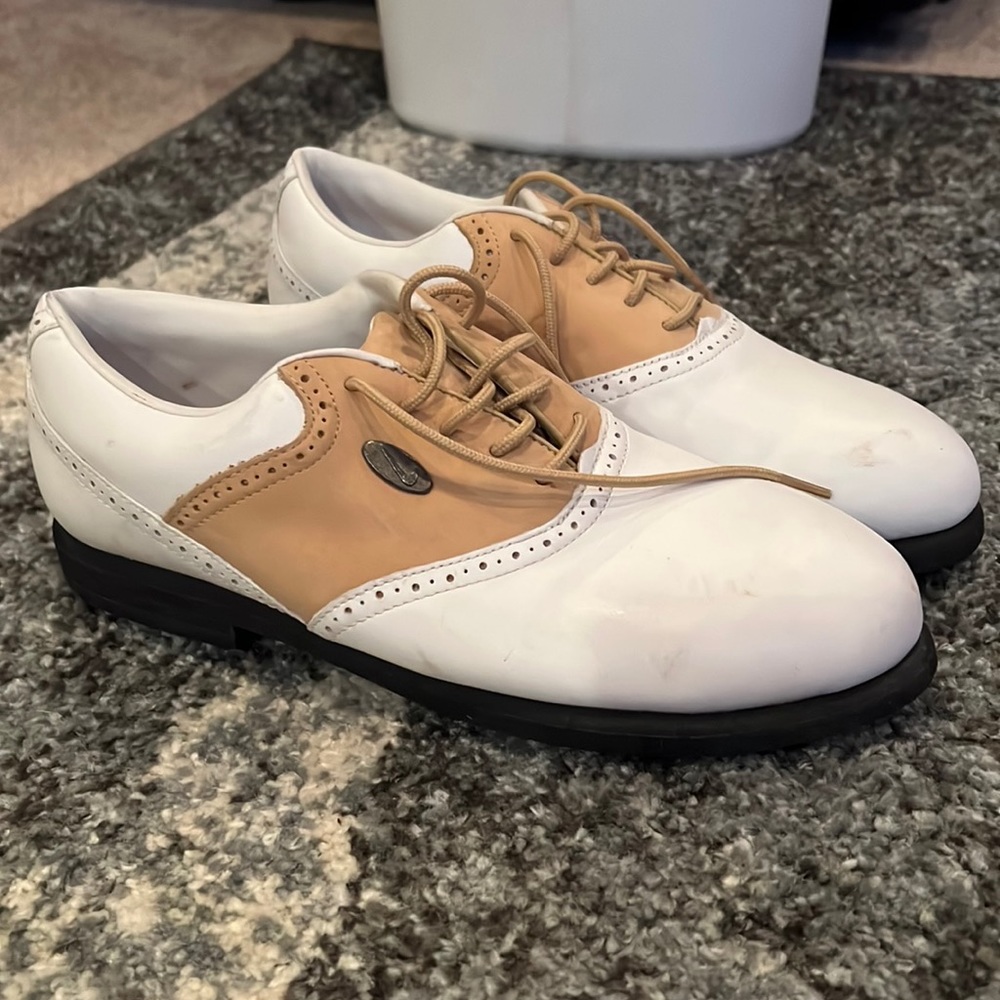 White and tan leather Nike golf shoes